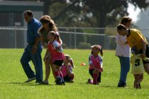 Natalie being helped off the field
