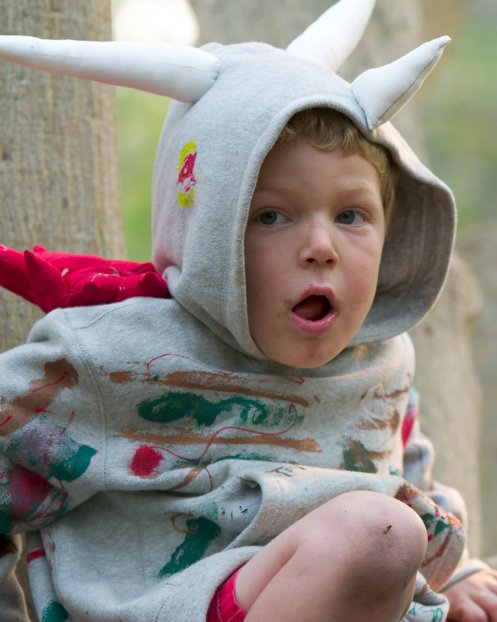 Timothy as a triceratops in a tree