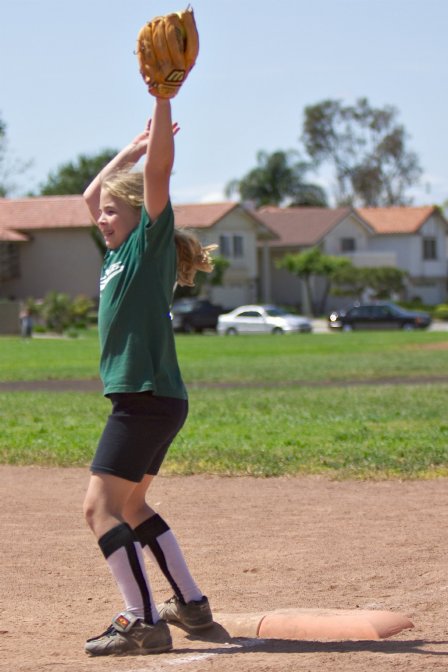 Nicole stretches to make the out at first