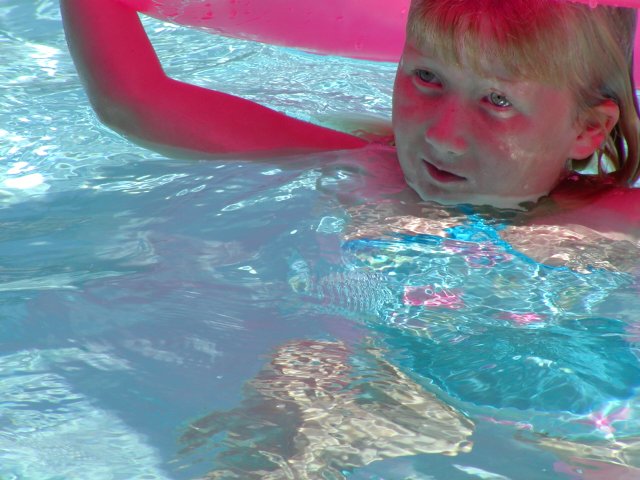 Sara under the pink tube